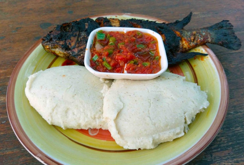 This is a traditional dish in Malawi. Chambo is a fish that can be found in Lake Malawi. Nsima is a side made of maize flour.